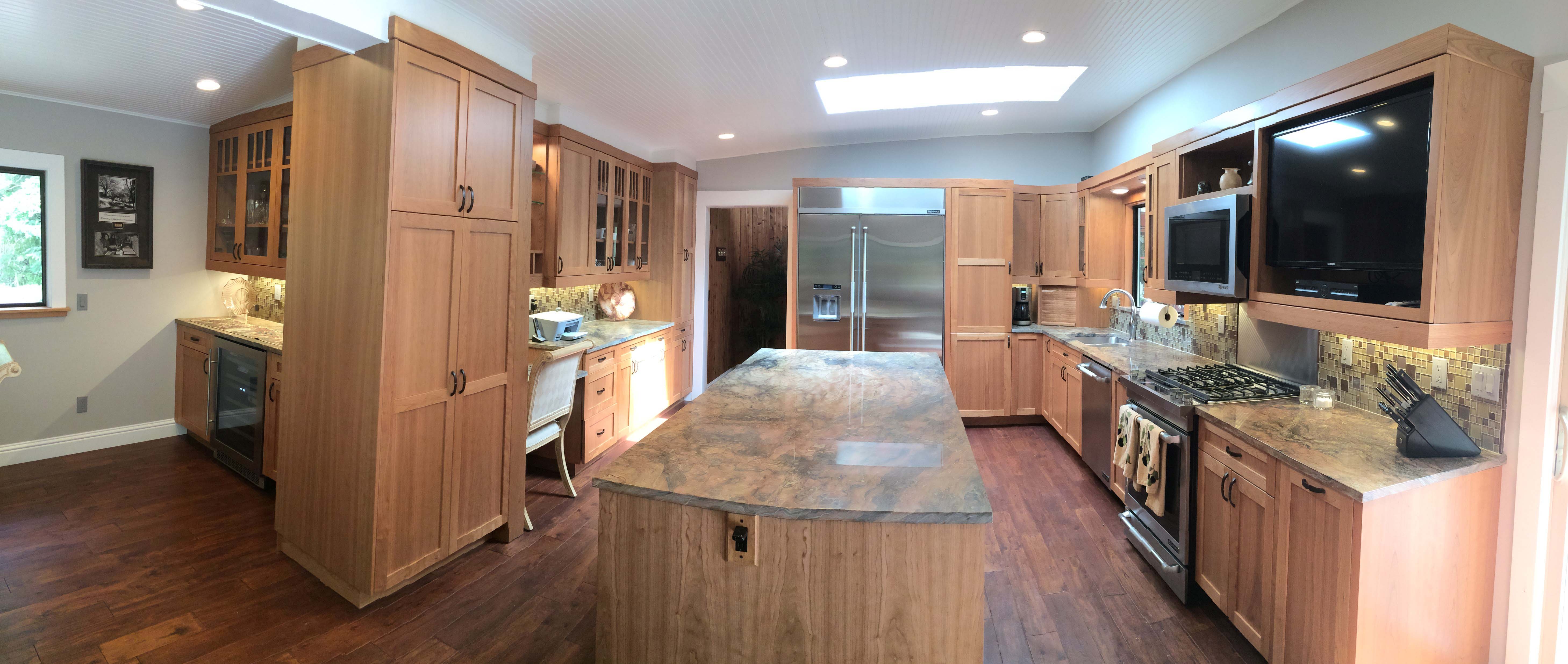 Custom Chef's Kitchen featuring marble kitchen island and marble countertops.